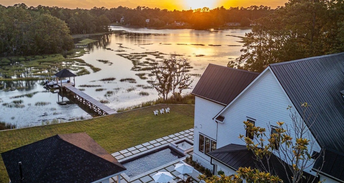 View of a custom built home on marshland, waterfront property